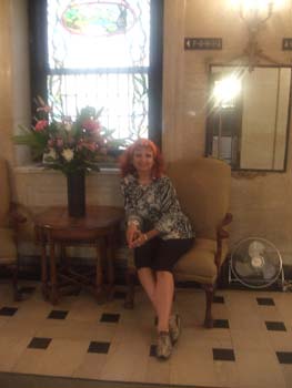 Chris Bleicher in entrance hall of her new home